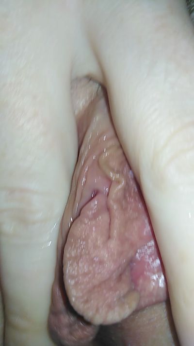 I caress my shaved pussy with my fingers close up